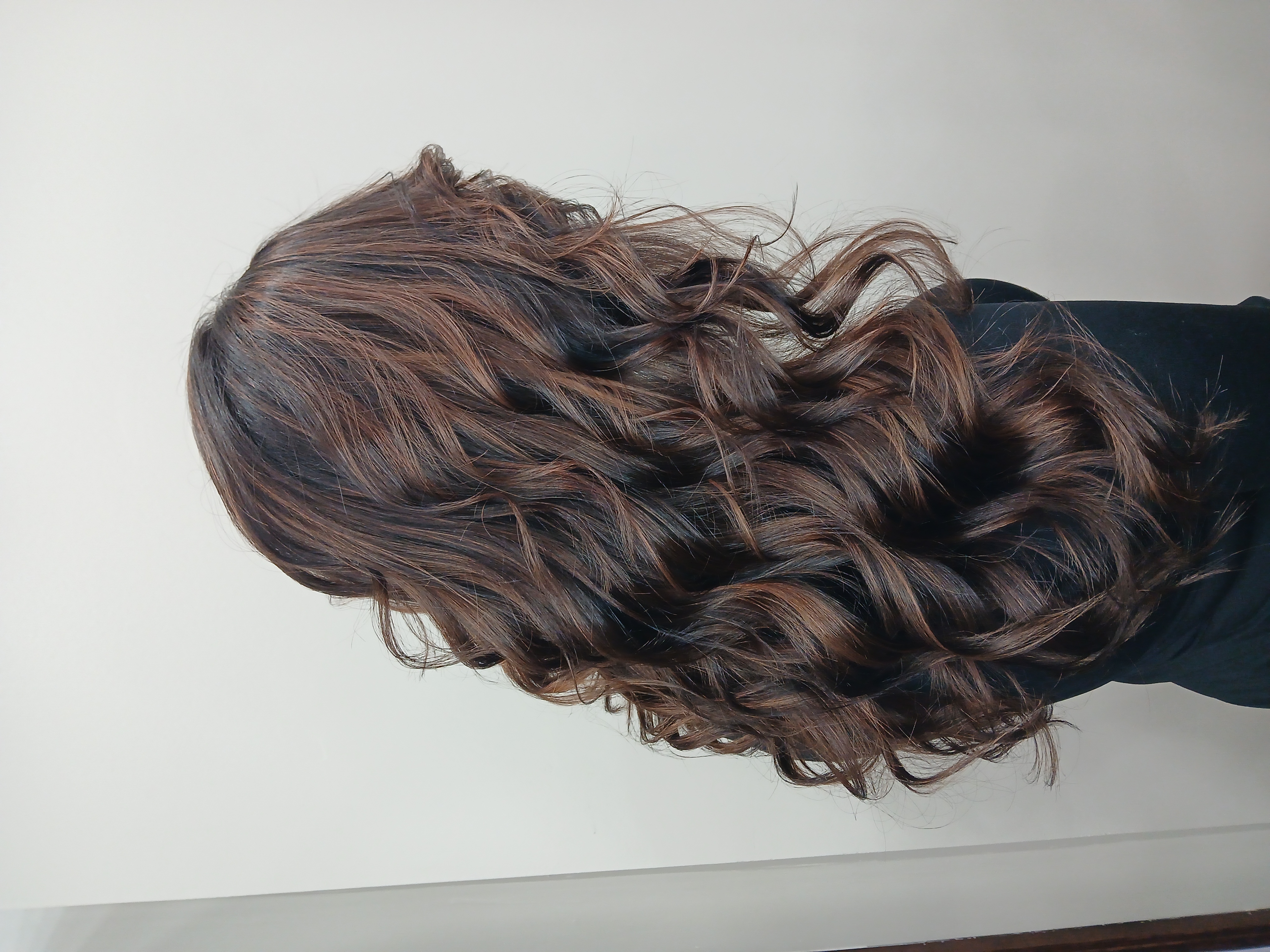 Brunette hair with rich color and natural volume from extensions